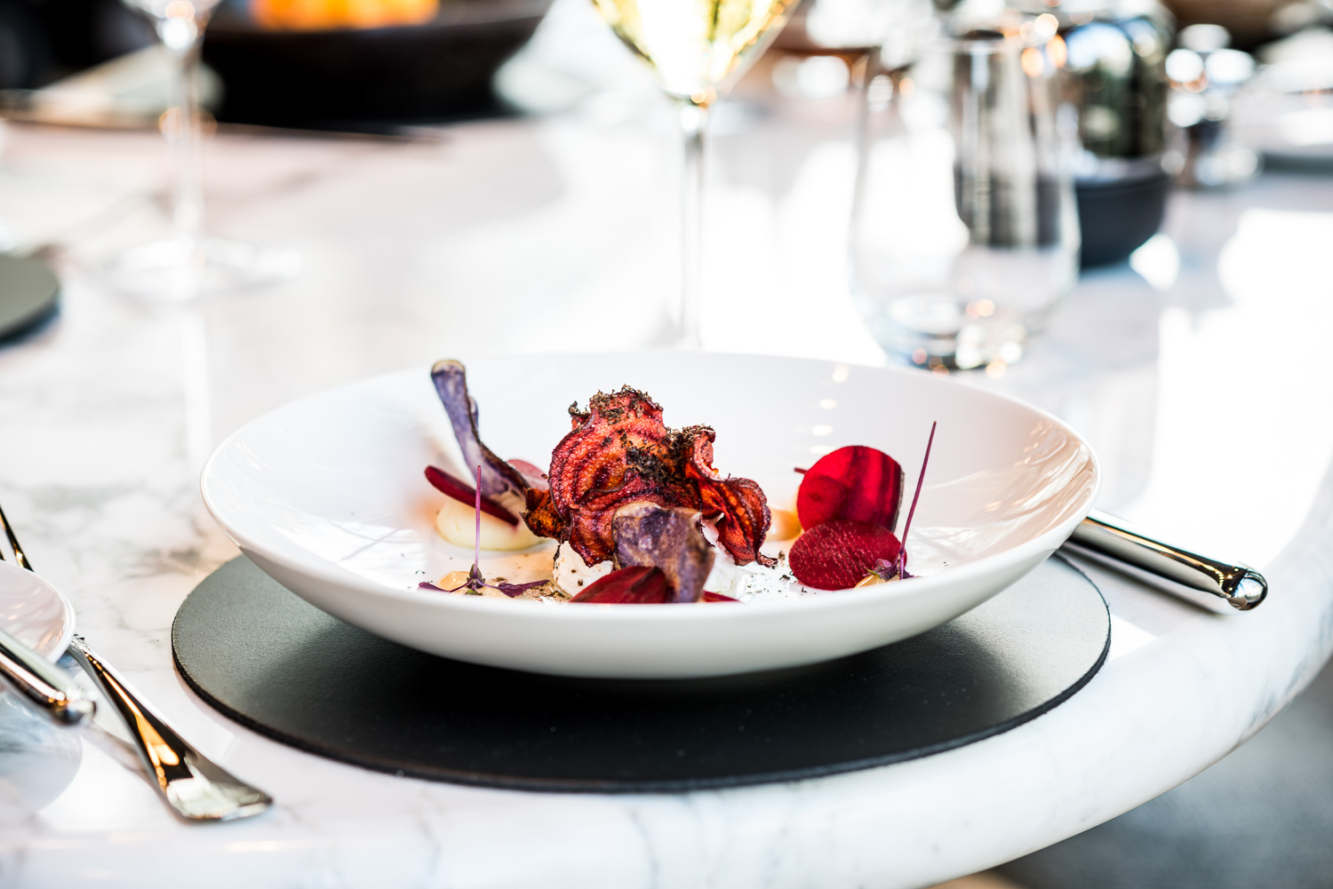 A white plate with grilled vegetables at Coperto Restobar in Zwolle