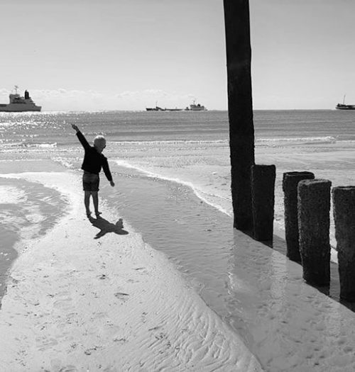 A small boy on the beach