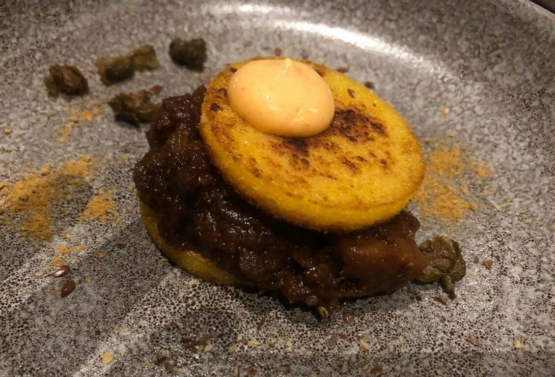 A plate with a vegetarian Rendang at Coperto Restobar in Zwolle
