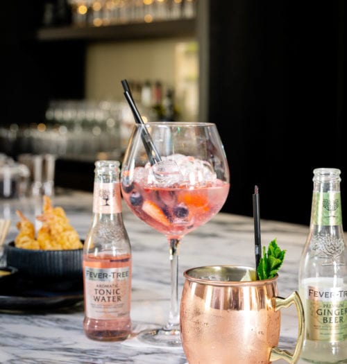 Gin Tonic and cocktails on a marble table at Coperto Restobar in Zwolle